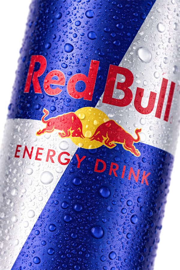 Close-up of a Red Bull can covered in water droplets
